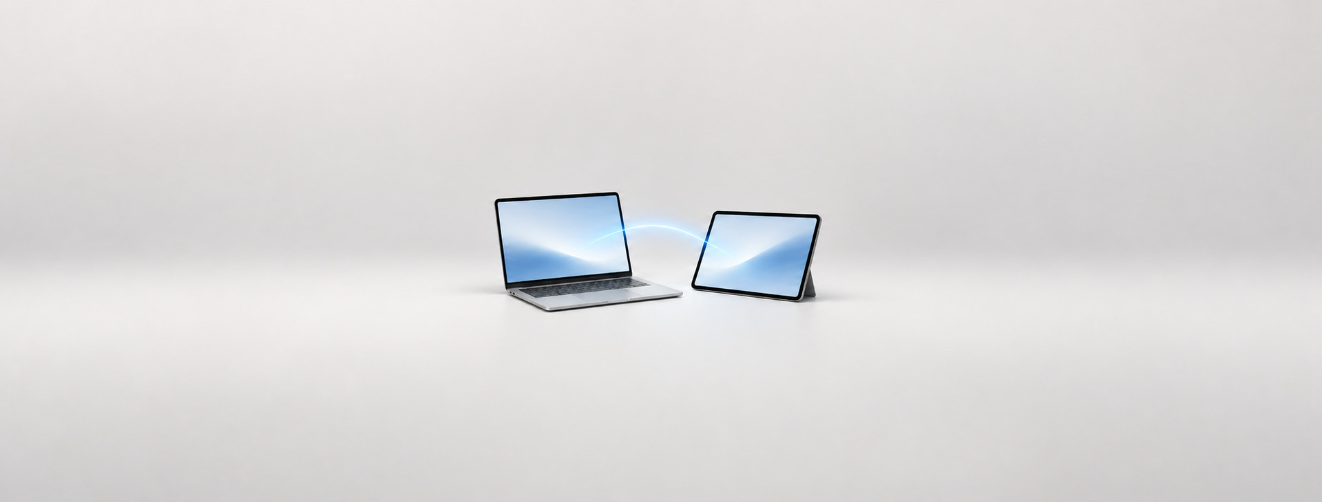 Mac 與 iPad 並排,以藍色光線呈現接續互通工作流程